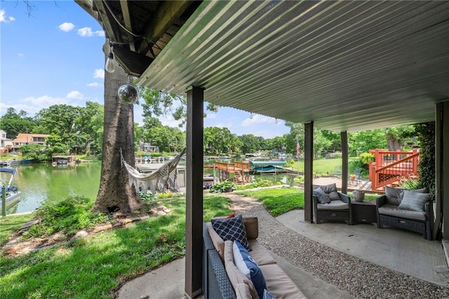 37 Beach Dr, Blue Springs, MO 64015 - view of patio / terrace featuring a water view, an outdoor hangout area, and a dock