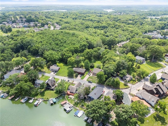 37 Beach Dr, Blue Springs, MO 64015 - aerial perspective of suburban area with a large body of water and a forest