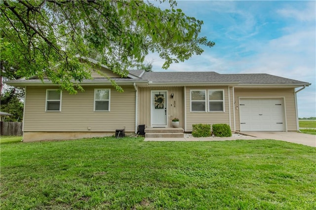 604 Lake Rd, Garden City, MO 64747 - single story home featuring an attached garage, driveway, and a front yard