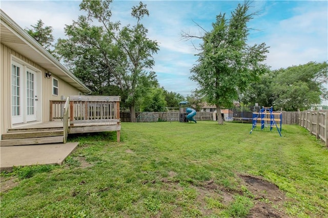604 Lake Rd, Garden City, MO 64747 - view of yard with a playground, a deck, and a trampoline