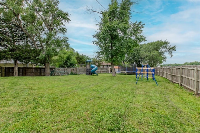 604 Lake Rd, Garden City, MO 64747 - view of yard featuring a playground and a trampoline