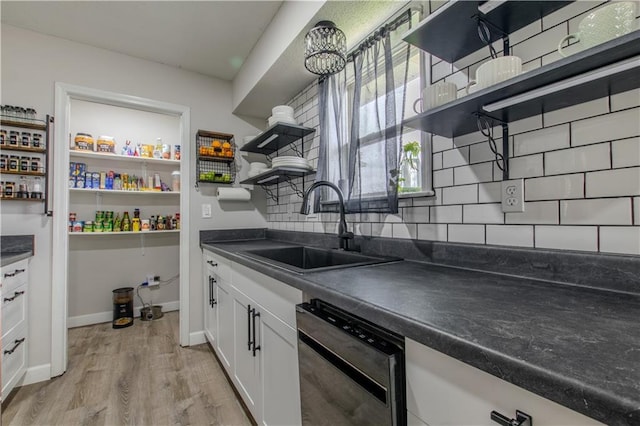 604 Lake Rd, Garden City, MO 64747 - kitchen featuring open shelves, a sink, dishwasher, and dark countertops