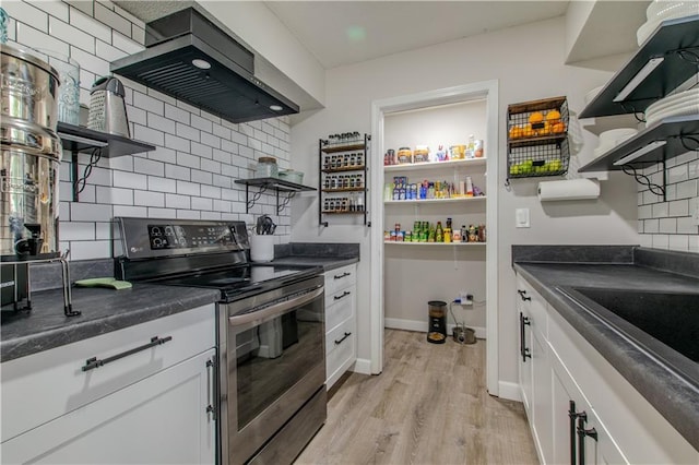 604 Lake Rd, Garden City, MO 64747 - kitchen featuring open shelves, stainless steel electric stove, wall chimney exhaust hood, dark countertops, and backsplash