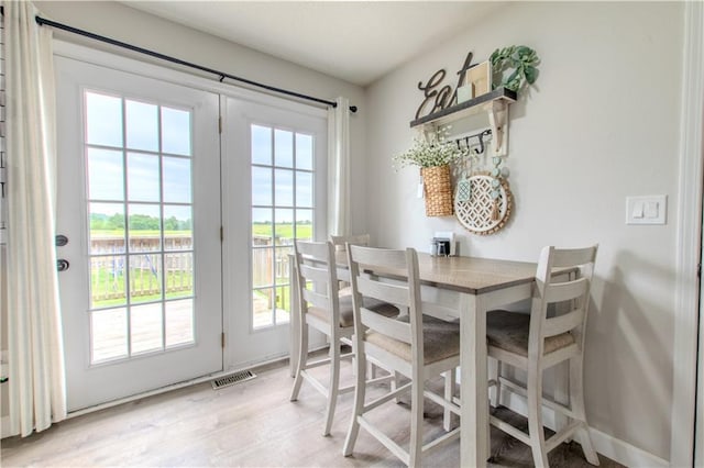 604 Lake Rd, Garden City, MO 64747 - dining area with light wood finished floors