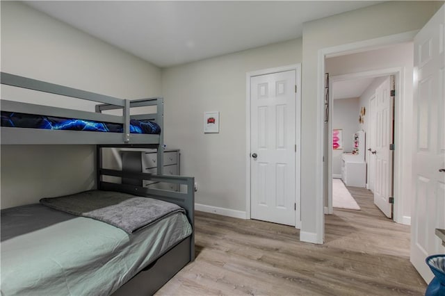 604 Lake Rd, Garden City, MO 64747 - bedroom featuring wood finished floors and baseboards