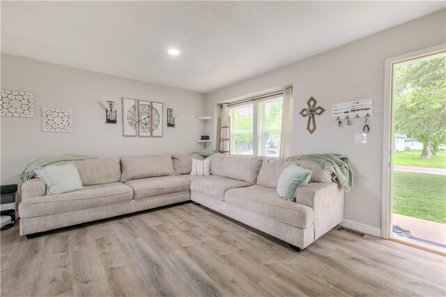 604 Lake Rd, Garden City, MO 64747 - living area featuring wood finished floors and baseboards