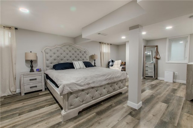 604 Lake Rd, Garden City, MO 64747 - bedroom with baseboards, wood finished floors, and recessed lighting