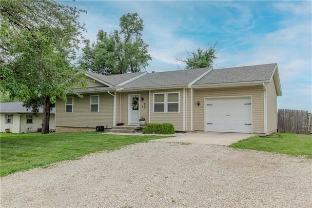 604 Lake Rd, Garden City, MO 64747 - ranch-style house featuring concrete driveway and a garage