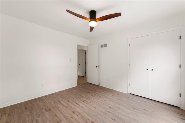 16000 E 28th St S, Independence, MO 64055 - unfurnished bedroom featuring light wood finished floors, a closet, baseboards, and ceiling fan