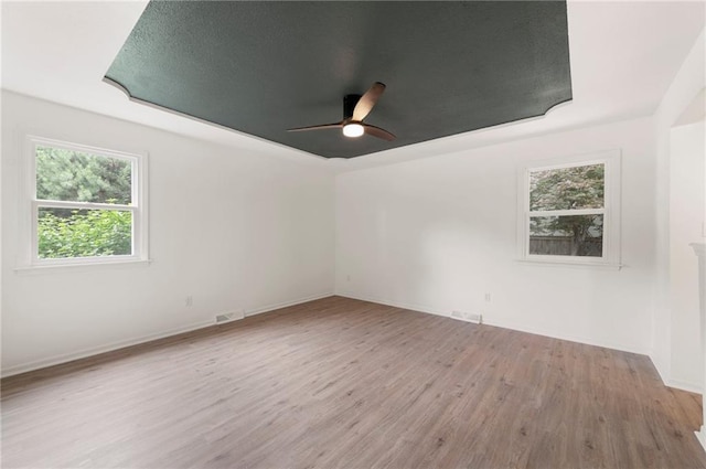16000 E 28th St S, Independence, MO 64055 - spare room featuring ceiling fan, wood finished floors, and baseboards