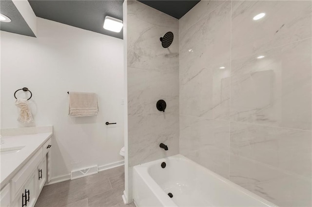 16000 E 28th St S, Independence, MO 64055 - bathroom featuring vanity, baseboards, bathtub / shower combination, and toilet