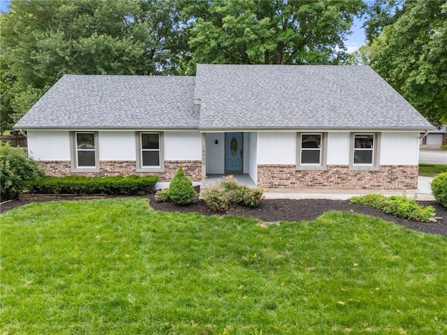 16000 E 28th St S, Independence, MO 64055 - view of front of home featuring a front lawn, roof with shingles, and brick siding