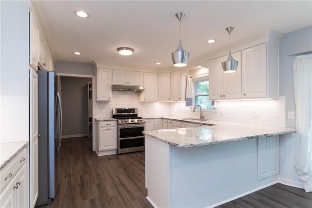 10246 Russell St, Overland Park, KS 66212 - kitchen featuring appliances with stainless steel finishes, a peninsula, under cabinet range hood, white cabinets, and recessed lighting