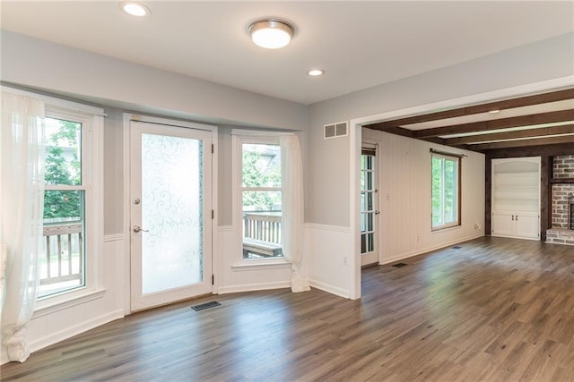 10246 Russell St, Overland Park, KS 66212 - entryway featuring wood finished floors, healthy amount of natural light, wainscoting, beamed ceiling, and recessed lighting