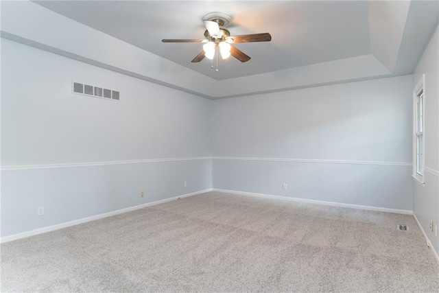 10246 Russell St, Overland Park, KS 66212 - empty room with ceiling fan, carpet, and a tray ceiling
