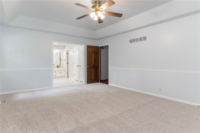 10246 Russell St, Overland Park, KS 66212 - empty room featuring a ceiling fan and light colored carpet