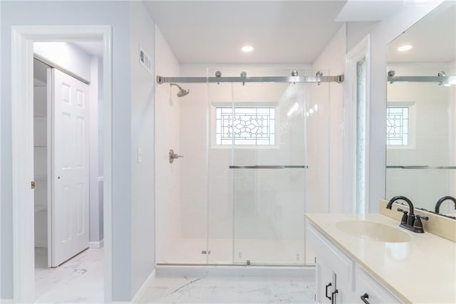 10246 Russell St, Overland Park, KS 66212 - bathroom with marble look tiles, a stall shower, vanity, and recessed lighting