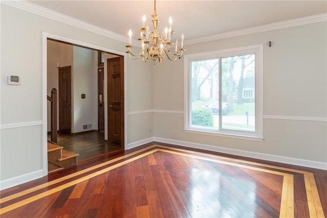 10246 Russell St, Overland Park, KS 66212 - spare room with wood finished floors, a chandelier, stairs, and ornamental molding