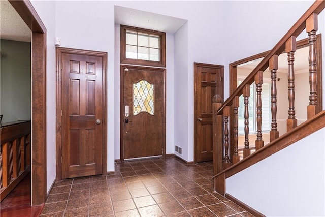 10246 Russell St, Overland Park, KS 66212 - entryway with stairs and a high ceiling