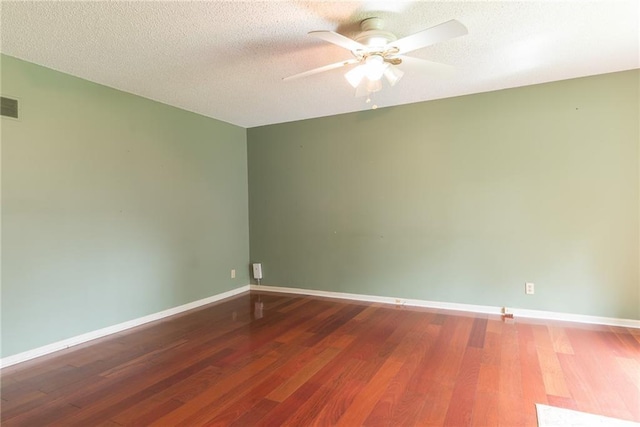 10246 Russell St, Overland Park, KS 66212 - unfurnished room with ceiling fan, wood finished floors, and a textured ceiling