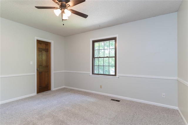 10246 Russell St, Overland Park, KS 66212 - carpeted empty room with a ceiling fan and a textured ceiling