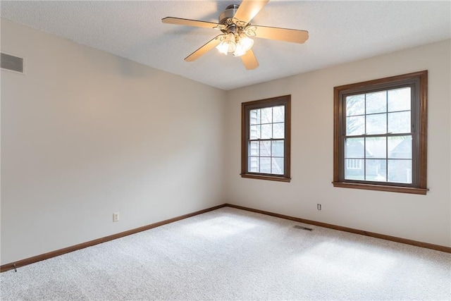 10246 Russell St, Overland Park, KS 66212 - spare room with carpet and a ceiling fan