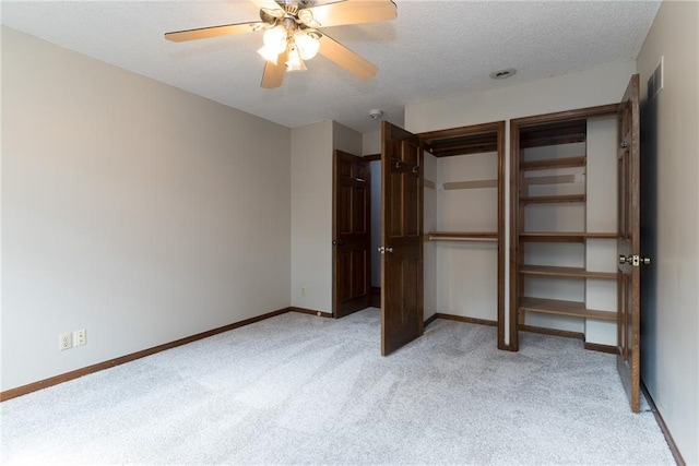 10246 Russell St, Overland Park, KS 66212 - unfurnished bedroom featuring light carpet, a textured ceiling, and ceiling fan