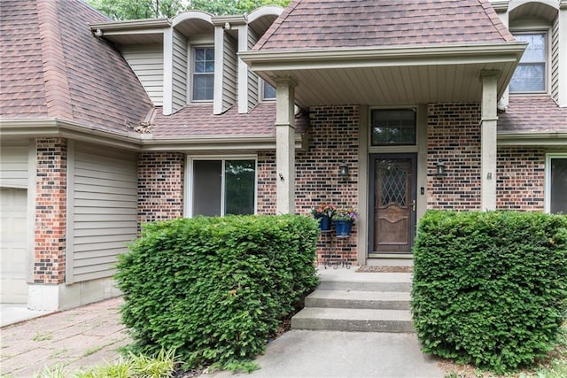 10246 Russell St, Overland Park, KS 66212 - property entrance featuring brick siding and roof with shingles