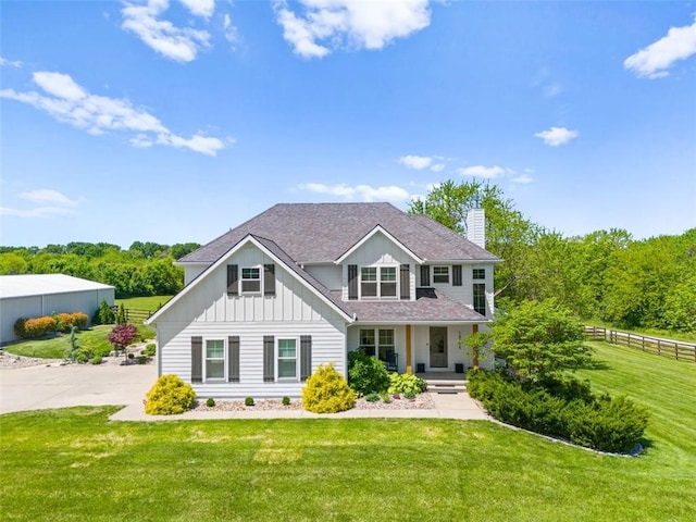 14906 Knorpp Rd, Pleasant Hill, MO 64080 - view of front of property with board and batten siding, a chimney, a porch, and a shingled roof