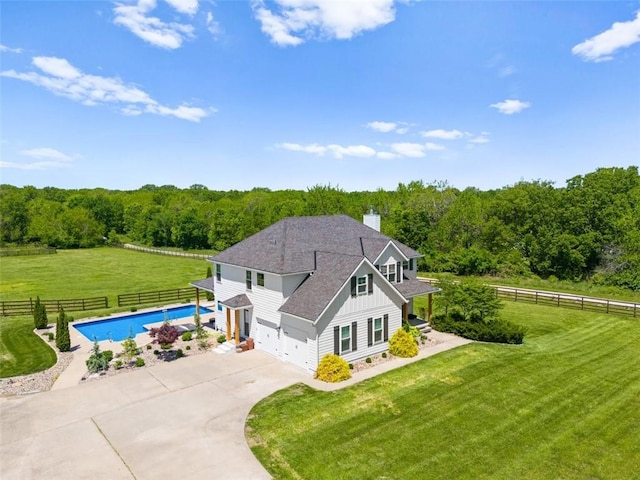 14906 Knorpp Rd, Pleasant Hill, MO 64080 - view of front facade with board and batten siding, concrete driveway, a fenced backyard, and a garage