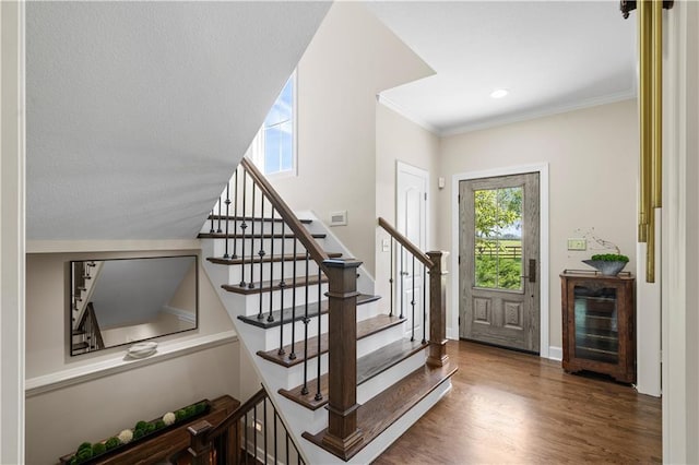 14906 Knorpp Rd, Pleasant Hill, MO 64080 - foyer entrance featuring beverage cooler, wood finished floors, stairway, and crown molding
