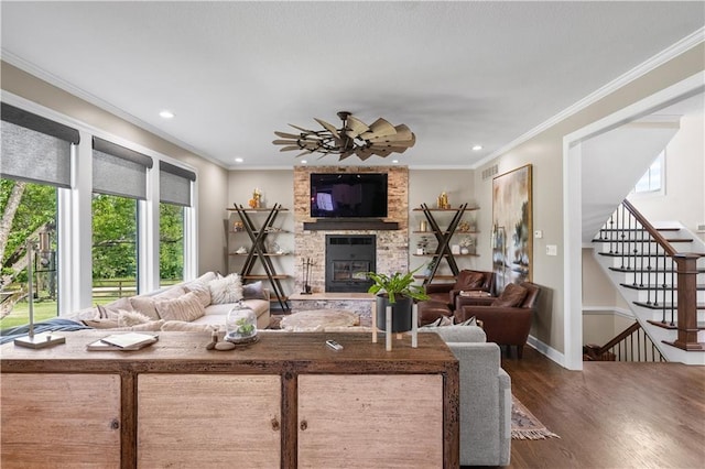 14906 Knorpp Rd, Pleasant Hill, MO 64080 - living room featuring healthy amount of natural light, a stone fireplace, dark wood-style flooring, stairs, and recessed lighting