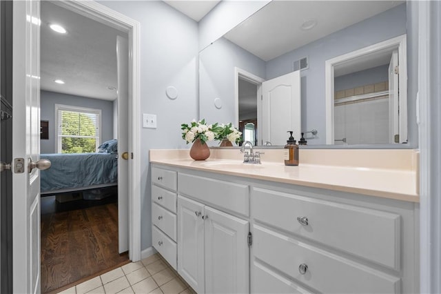 14906 Knorpp Rd, Pleasant Hill, MO 64080 - full bathroom featuring connected bathroom, vanity, and tile patterned floors