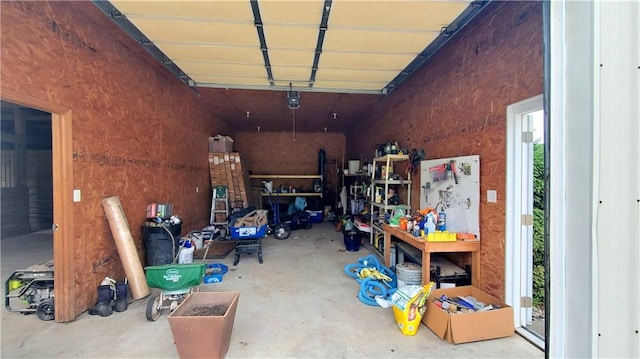 14906 Knorpp Rd, Pleasant Hill, MO 64080 - garage featuring a workshop area and a garage door opener
