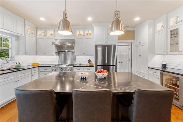 5812 Reinhardt Dr, Fairway, KS 66205 - kitchen featuring dark countertops, freestanding refrigerator, range, beverage cooler, and recessed lighting