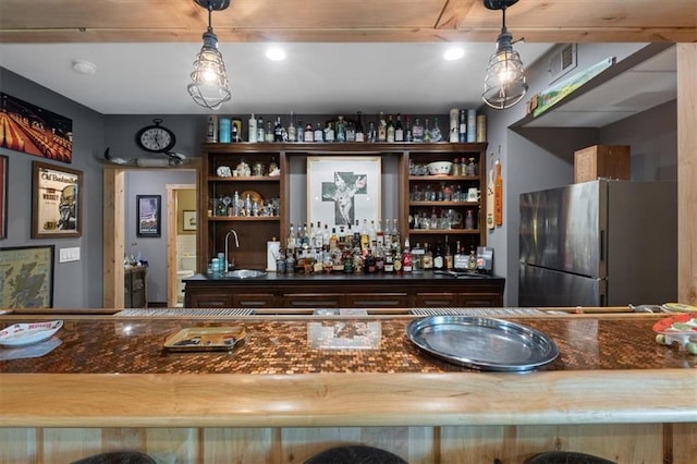 5812 Reinhardt Dr, Fairway, KS 66205 - indoor wet bar with freestanding refrigerator and decorative light fixtures