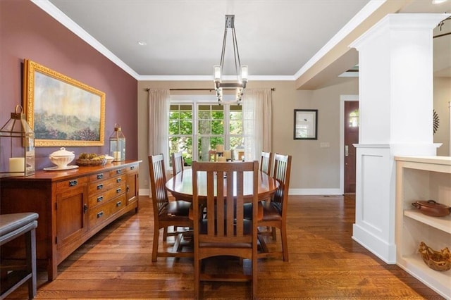 5812 Reinhardt Dr, Fairway, KS 66205 - dining area featuring wood finished floors, a chandelier, baseboards, and crown molding