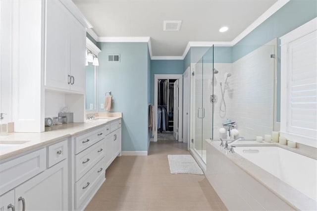 5812 Reinhardt Dr, Fairway, KS 66205 - bathroom featuring a shower stall, a bath, crown molding, double vanity, and baseboards