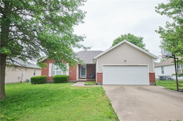 500 Valley View Dr, Frontenac, KS 66763 - view of front of house featuring brick siding, a front yard, and a garage