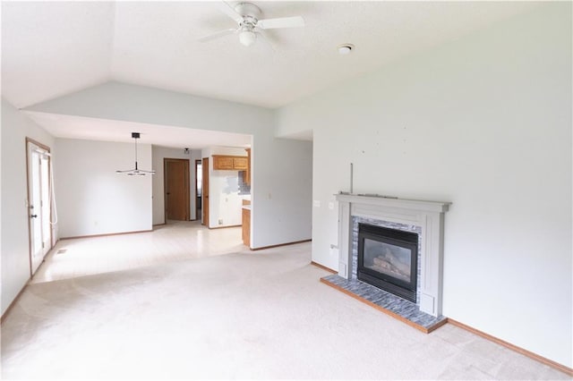500 Valley View Dr, Frontenac, KS 66763 - unfurnished living room with light carpet, a ceiling fan, a glass covered fireplace, and vaulted ceiling