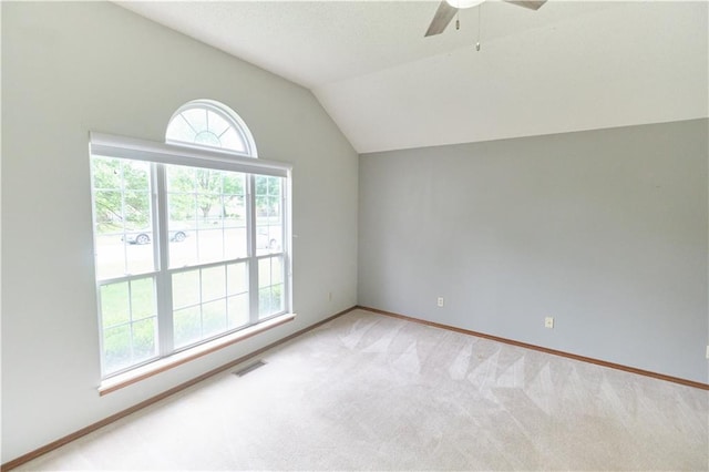 500 Valley View Dr, Frontenac, KS 66763 - spare room with vaulted ceiling, a ceiling fan, and light carpet