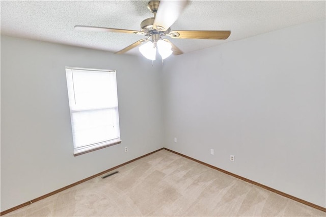 500 Valley View Dr, Frontenac, KS 66763 - spare room featuring ceiling fan, light colored carpet, and a textured ceiling