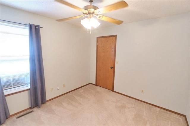 500 Valley View Dr, Frontenac, KS 66763 - empty room with healthy amount of natural light, light carpet, and a ceiling fan
