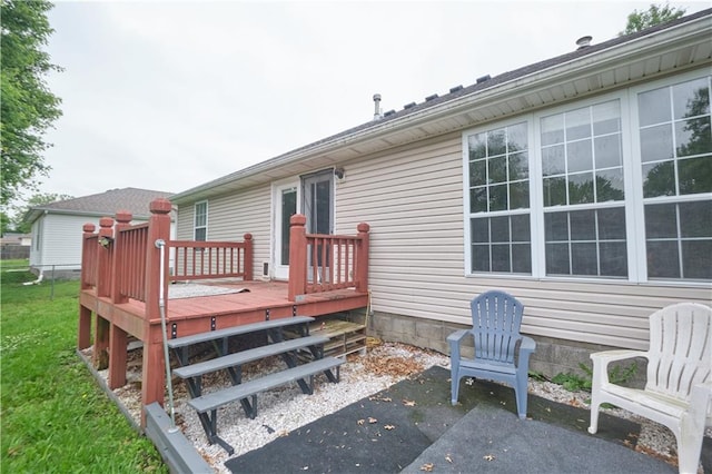 500 Valley View Dr, Frontenac, KS 66763 - rear view of house featuring a deck, a patio, and a lawn