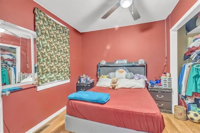 8303 Wabash Ave, Kansas City, MO 64132 - bedroom featuring wood finished floors and a ceiling fan