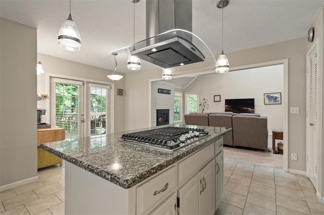 8410 W 117th St, Overland Park, KS 66210 - kitchen featuring stainless steel gas stovetop, dark stone counters, white cabinets, open floor plan, and pendant lighting