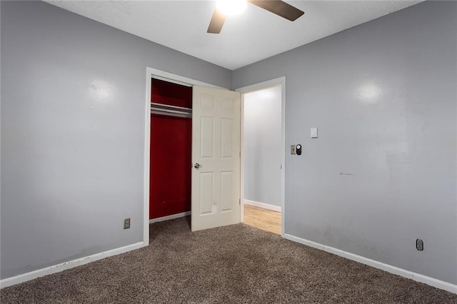 10203 Outer Rd, Odessa, MO 64076 - unfurnished bedroom featuring carpet flooring, a closet, and a ceiling fan