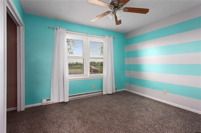 10203 Outer Rd, Odessa, MO 64076 - unfurnished room with baseboard heating, a textured ceiling, dark carpet, and a ceiling fan