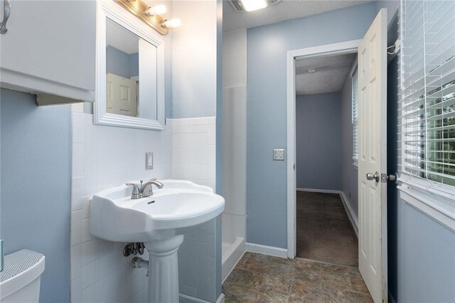10203 Outer Rd, Odessa, MO 64076 - bathroom with toilet and stone finish floors