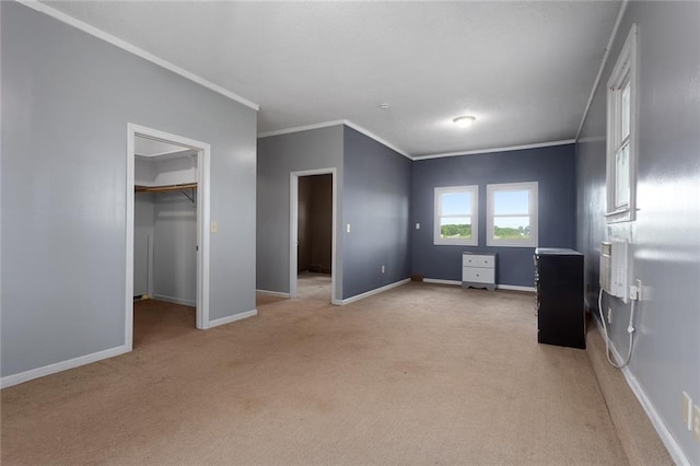 10203 Outer Rd, Odessa, MO 64076 - unfurnished bedroom featuring light carpet, crown molding, and a spacious closet